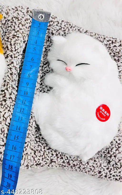 White & grey sleeping musical cat plush toy for car, office decor. Soft, meowing furry cat figurine, perfect gift idea." (104 characters)