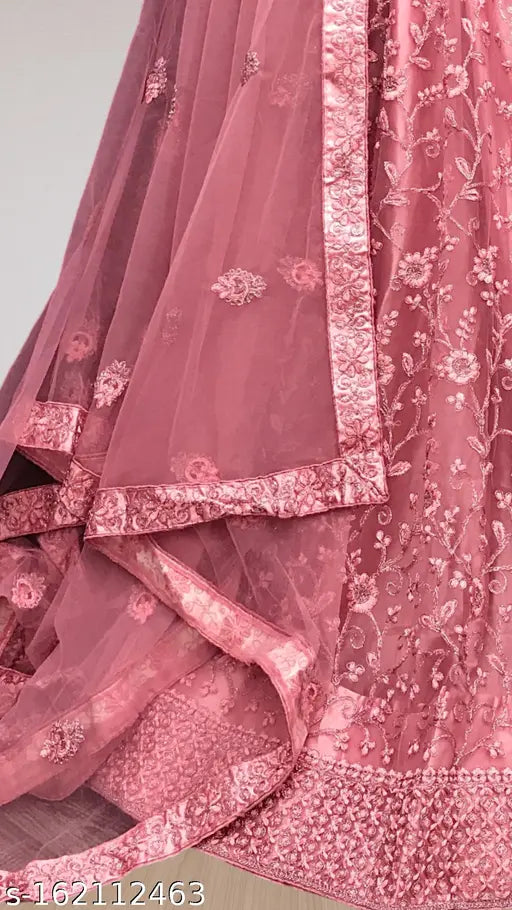 Trendy traditional net semi-stitched pink lehenga choli with matching dupatta for women and girls, featuring embroidered patterns. Best quality Indian ethnic wear for parties, weddings, or casual events