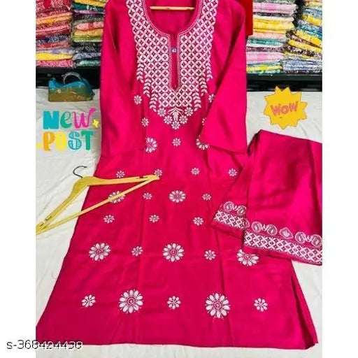 Elegant red Chikankari rayon embroidery kurti and palazzos for women, featuring three-quarter sleeves. India-made, 14kg set