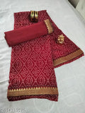 High-quality georgette bandhani saree in red, featuring a printed design and lace border, paired with a satin silk blouse. Comes with matching accessories