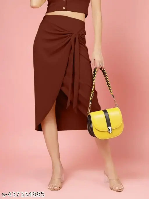 Brown ribbed wraparound skirt with a high waist, mid-length, and a yellow clutch