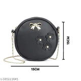 Black leather sling bag with multiple pockets, suitable for office or casual settings. Part of a two-bag set