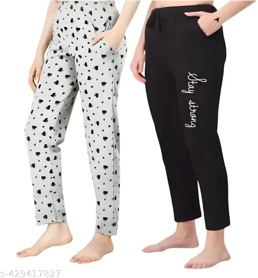 Black and white polka dot sweatpants with drawstring closures