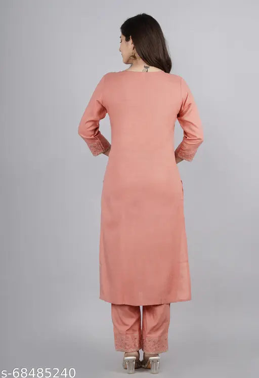 Peach-colored rayon kurta pant suit with embroidered net, three-quarter sleeves, and palazzo bottoms for women's fashion