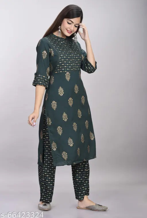 Stylish rayon women's kurta and palazzo set with three-quarter sleeves, printed net pattern. Rayon fabric for lightweight, comfortable wear for functions, festivals, parties, weddings in India