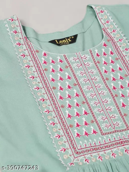 The image shows a blue embroidered women's blouse with sleeves and round neckline, designed in ankle length flared style