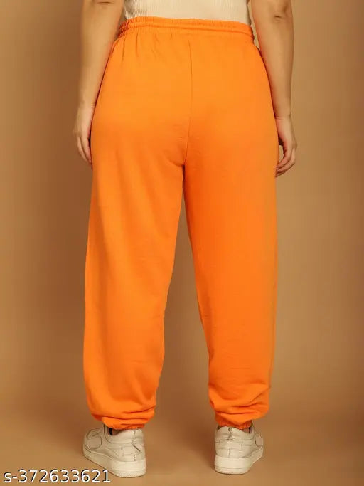 Orange nylon jogger pants by NOBARR, elasticated waist, drawstring detail, ankle length, made in India