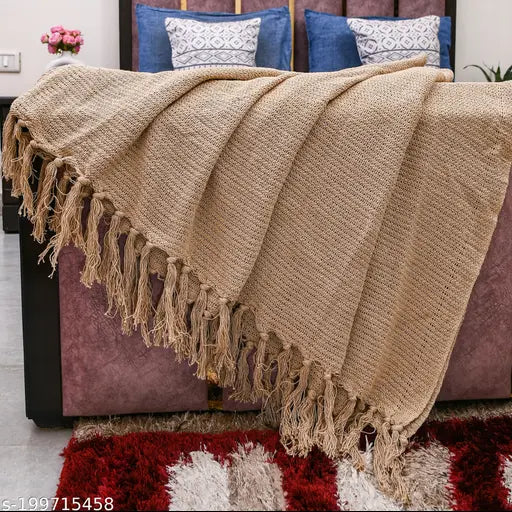 Beige cotton fringed throw blanket on sofa, 150cm x 125cm