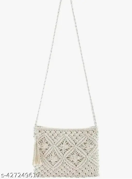 Handcrafted macramé crossbody sling bag, off-white color with a fringe detail