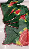 A brightly colored georgette saree with a vibrant floral pattern and embellishments, suitable for party wear or daily wear