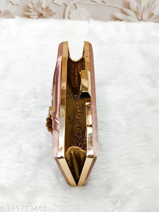 Pink metallic clutch purse with a cat design