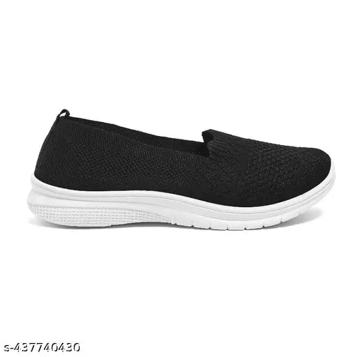 Black, lightweight slip-on shoes with a white sole and white trim