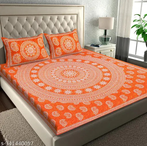 Orange Jaipuri Cotton Bedsheet Combo Pack with 4 Pillow Covers on a Bed