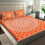 Orange Jaipuri Cotton Bedsheet Combo Pack with 4 Pillow Covers on a Bed