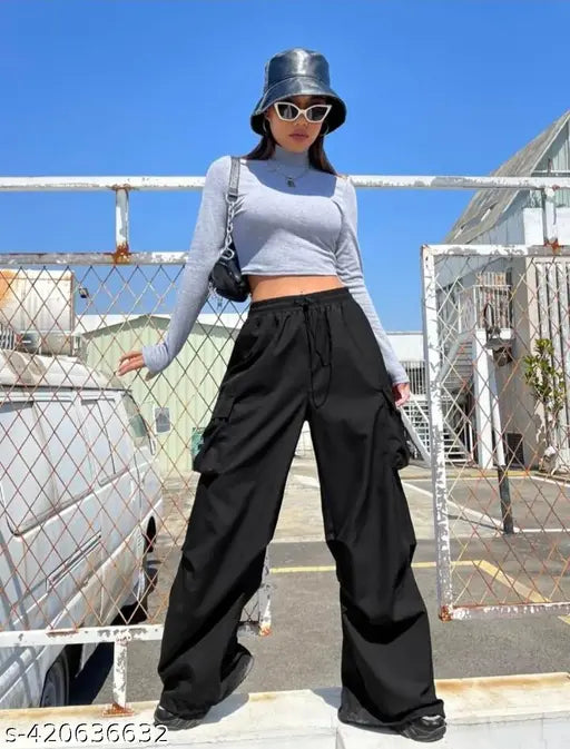 Black cargo pants, wide leg openings, casual style, woman posing