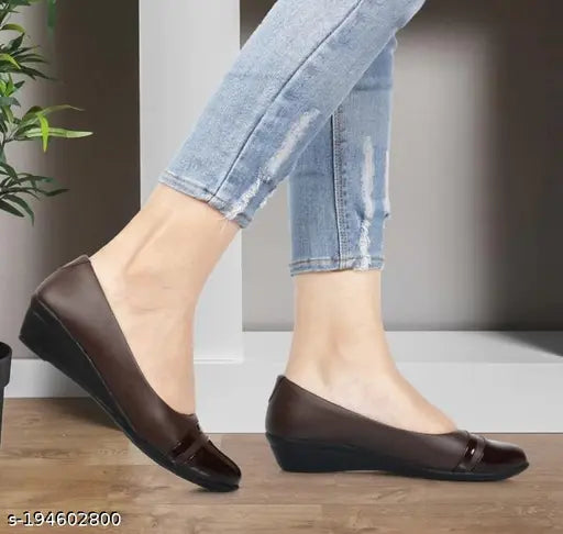 Woman wearing brown sandals, blue jeans