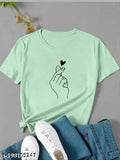 Green cotton blend printed round neck half sleeve t-shirt for women, casual fashion on display