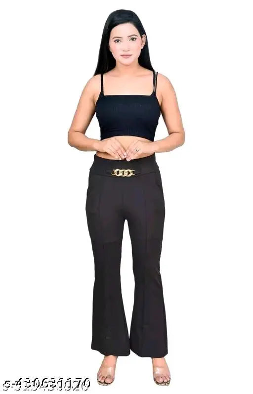 A woman wearing high-waisted, baggy-legged pants in a solid color