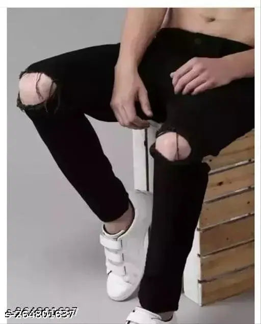 Men's black denim knee-cut jeans, high-quality solid fabric for a comfortable fit. Available in sizes 28, 30, and 32 (28:28/40/30, 30:30/40/32, 32:32/40/34). Made in India