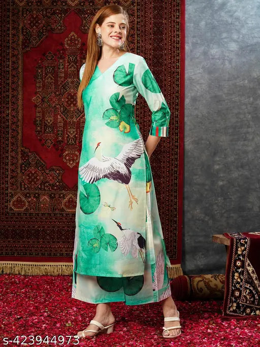 Green cotton blend printed straight kurta with palazzos, three-quarter sleeves, and pants - Indian women's fashion outfit on display