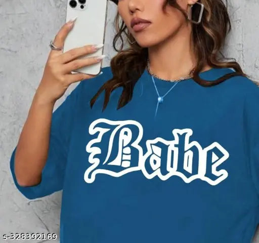 A blue, round-neck cotton blend t-shirt with a large graphic print reading "BABE" in white letters