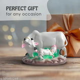 Handmade resin Cow with Calf idol for home, temple, office, gifting. Symbolizes prosperity and love, suitable for spiritual decor. Product dimensions: L19.5cm x H12cm x B12cm. Color may vary due to lighting or monitor settings. Made in India