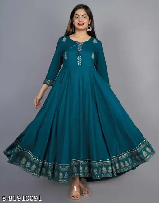Green kameez dress with flared sleeves and traditional paisley design, perfect for festivals