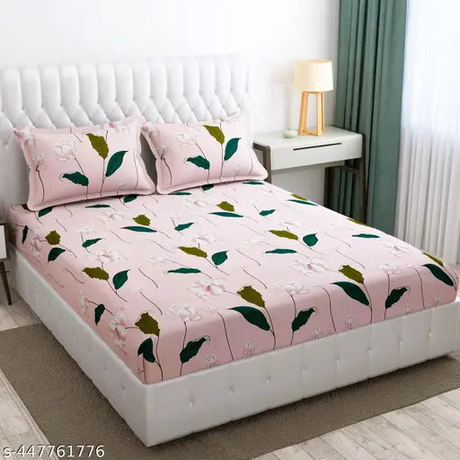 Pink cotton queen size bedsheet with 2 pillow covers, 18x28 inches, bedside table.