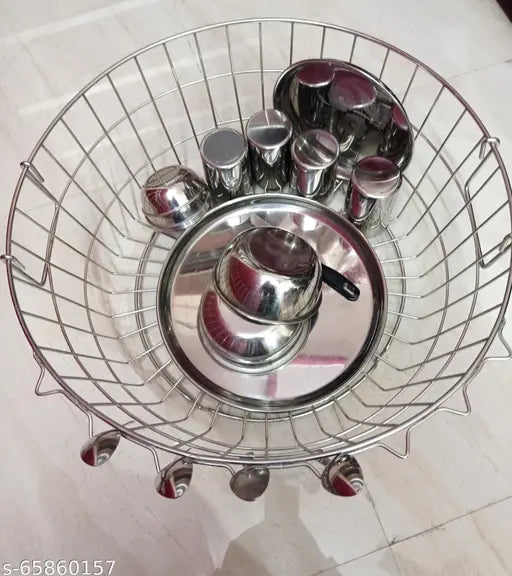 Stainless steel dish drainer. Akaya Creations product. Kitchen drying rack. Round metal basket with elevated drainage holes. Silver-toned kitchen accessory. Dish drying plate organizer. Bartan kitchen storage solution