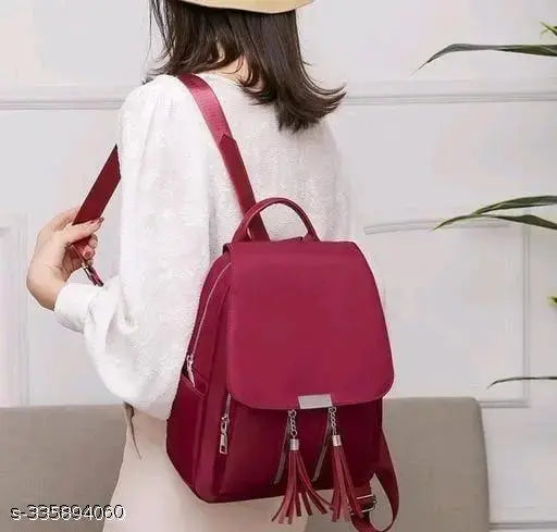 Purple backpack with tassels, suitable for school and office, with two straps