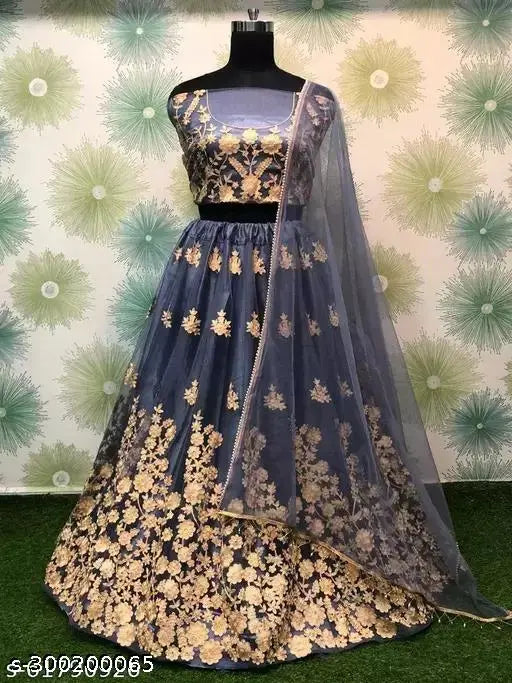 Embroidered net semi-stitched Lehenga Choli and lace dupatta, Indian bridal wear on display stand