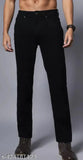 Dark blue denim jeans with classic stitching, cuffed ankles, and button fly front pocket