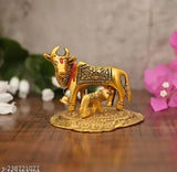 Golden bronze Kamdhenu cow statue with calf, 11cm tall for home decor & gifting