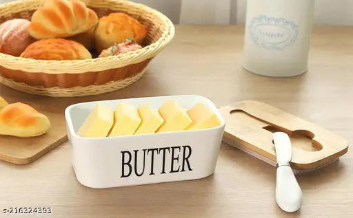 Large white ceramic butter dish with wooden lid, steel butter knife, and silicone seal ring