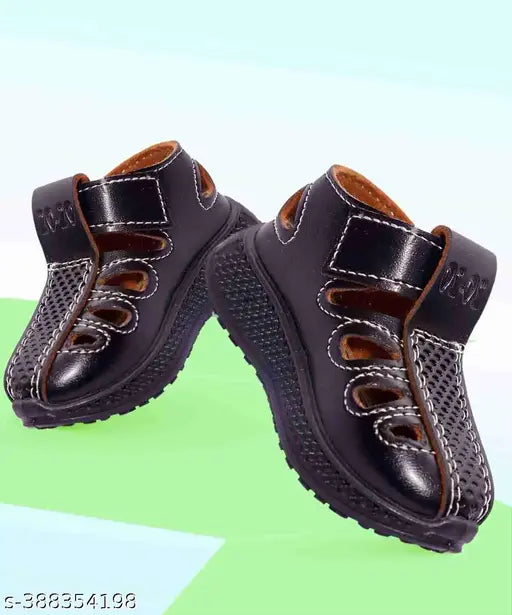 Black casual sandals with brown straps and white soles, designed for both boys and girls