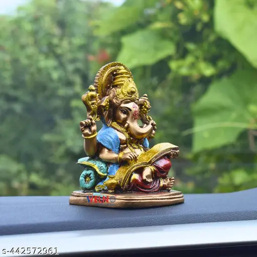 Small Ramayana Reading Ganesha for car dashboard and table decor - Indian religious idol for northeast Vastu decoration, promotes wealth, health, peace, and happiness