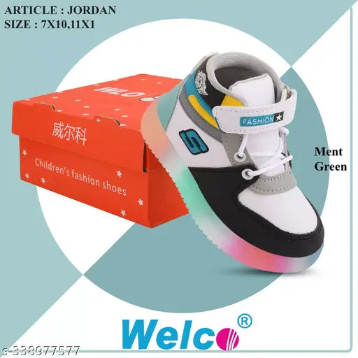 Children's black and blue sneakers with laces, inside a red and white box