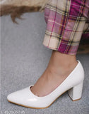 White block heel pumps, glossy finish, pointy toe