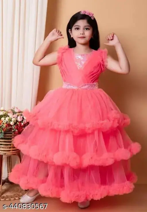 Pink chiffon dress with ruffles, spaghetti straps, and tiers