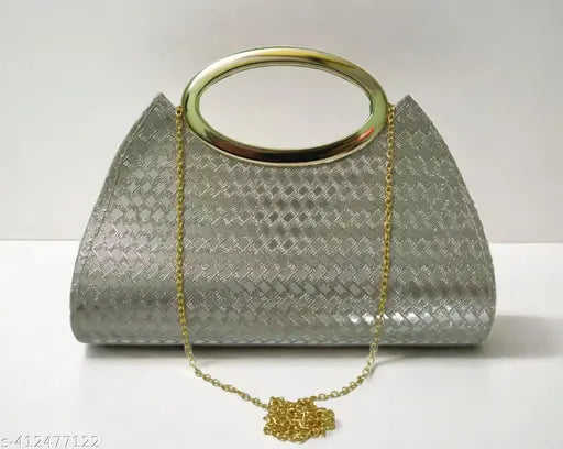 Gold-tone clutch purse with a heart pendant and gold chain strap