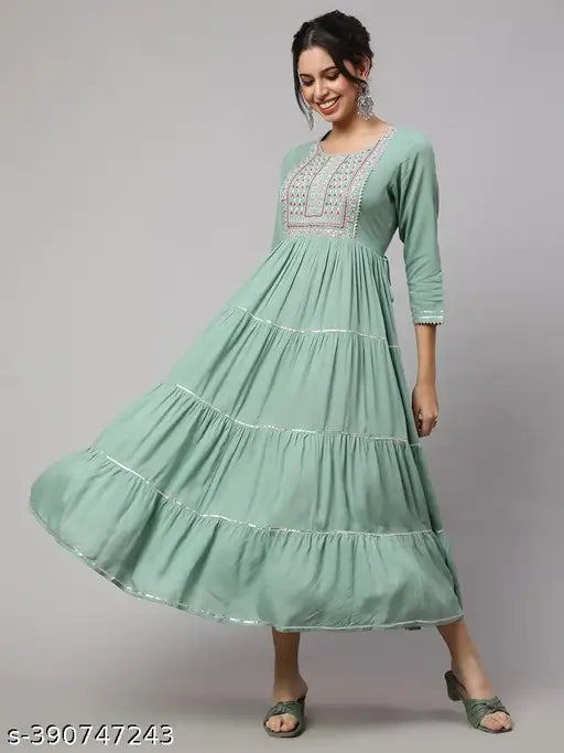 Light blue rayon kameez with round neck, long sleeves, and flared ankle length