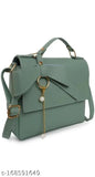 A synthetic vegan leather crossbody handbag with a top handle and shoulder strap, featuring a unique design with metallic details
