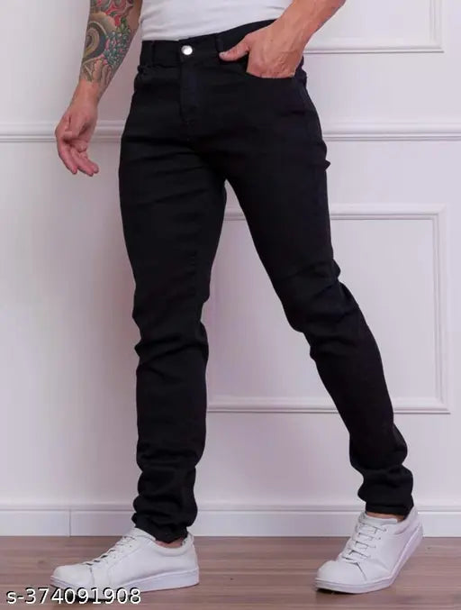 Black slim men's denim jeans with stretch, mid-rise, and two pockets. Casual or party wear for adult males. Denim fabric, solid black color, button & zip closure, sizes: 28 (28in/40in), 30 (30in/40in), 32 (32in/40in). Made in India