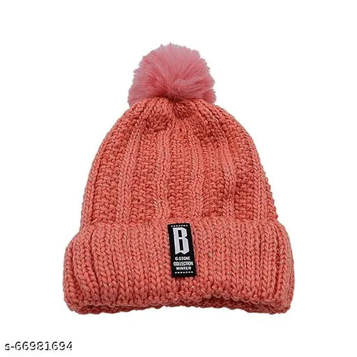 Pink knit beanie hat with thick cotton lining and a pom-pom