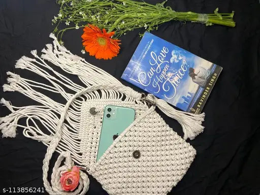 White macrame sling bag with tassels and two pockets