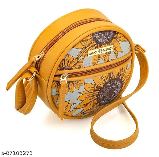 Round purse with sunflower design, tan leather material, and a circular crossbody strap