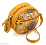 Round purse with sunflower design, tan leather material, and a circular crossbody strap