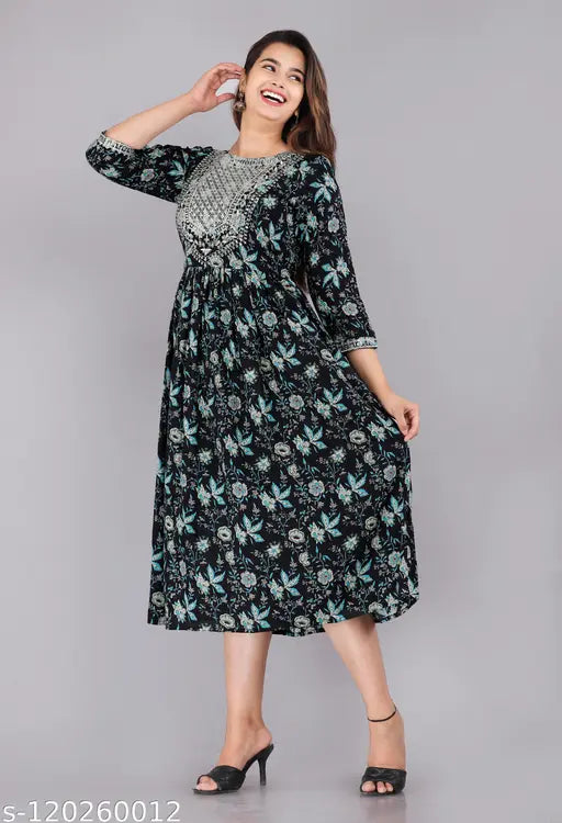 Rayon flared kurta with three-quarter sleeves, printed combo, size M-XXL. Traditional art meets modern fashion in this stylish women's kurti by VASHINEH, featuring a beautiful floral print