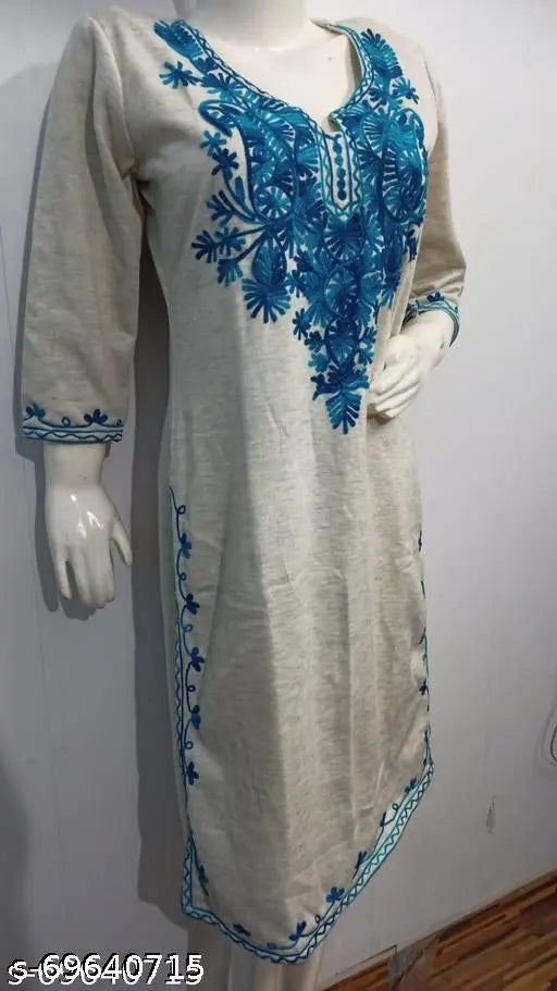 Woolen kurti with light grey embroidery and blue paisley embroidery on a woman's mannequin