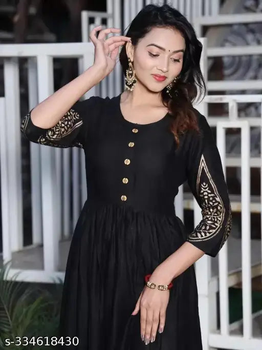 Handcrafted rayon kurti gown with gold print pattern, adding traditional artistry and uniqueness